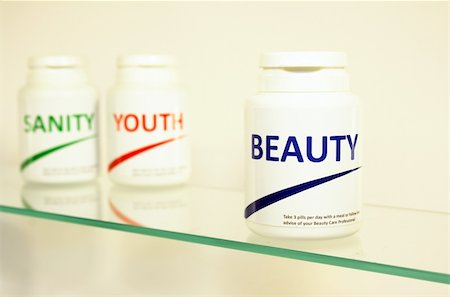 pontuse (artist) - Sanity, Beauty and Youth pills in a bottle on bathroom shelf with focus on Beauty, fake brands Stockbilder - Microstock & Abonnement, Bildnummer: 400-04698304