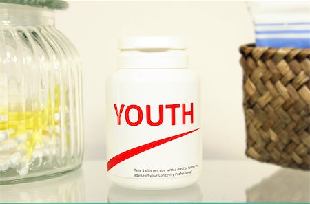 pontuse (artist) - Youth pills in a bottle on bathroom shelf, fake brand Stockbilder - Microstock & Abonnement, Bildnummer: 400-04698300