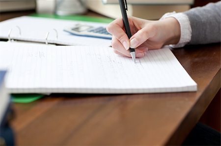 simsearch:400-04484714,k - Close-up of a female student doing her homework at home Stock Photo - Budget Royalty-Free & Subscription, Code: 400-04698689