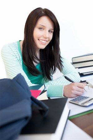 simsearch:400-08296114,k - Happy teen girl studying on a desk at home Stockbilder - Microstock & Abonnement, Bildnummer: 400-04698690