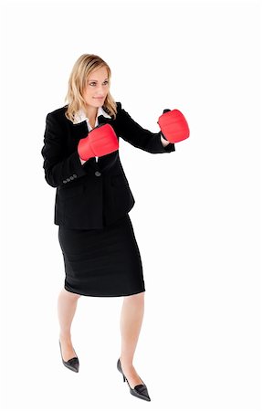 Self-assured businesswoman with red boxing gloves against white background Stock Photo - Budget Royalty-Free & Subscription, Code: 400-04699071