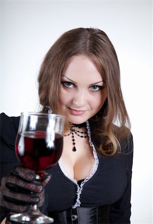 simsearch:400-04629496,k - Sensual blue-eyed woman with glass of wine, studio shot Photographie de stock - Aubaine LD & Abonnement, Code: 400-04699405