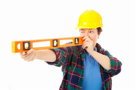 simsearch:400-05704663,k - Female construction worker using a level.  Isolated on white. Stock Photo - Budget Royalty-Free & Subscription, Code: 400-04699558