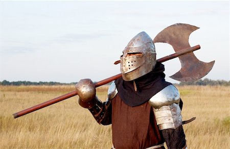 Medieval knight in the field with an axe Stock Photo - Budget Royalty-Free & Subscription, Code: 400-04699964
