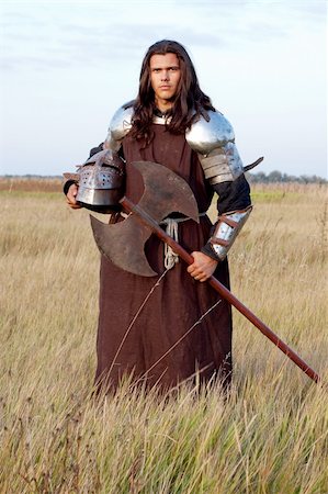 Medieval knight in the field with an axe Stock Photo - Budget Royalty-Free & Subscription, Code: 400-04699970