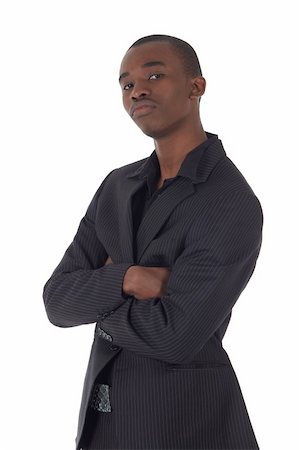 simsearch:400-04662774,k - Young Adult black african businessman wearing a dark smart-casual suit and Jacket on a white background in various poses with various facial expressions. Part of a series, Not Isolated. Foto de stock - Royalty-Free Super Valor e Assinatura, Número: 400-04690063