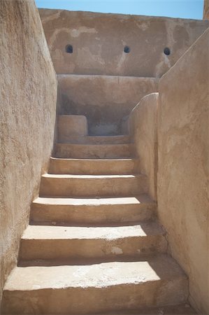 reconstruyendo - Staircase inside the rebuilt historic Fort Zubarah (Al Zubara) in North East of the deserts of Qatar on the edge of the Persian gulf on a sunny summer day Photographie de stock - Aubaine LD & Abonnement, Code: 400-04690118