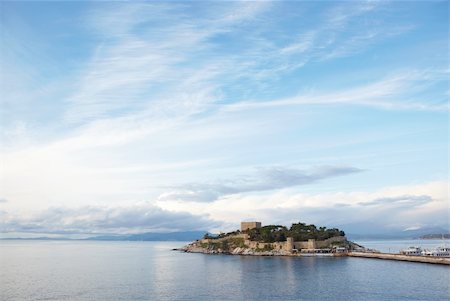 simsearch:400-04473180,k - Pigeon Island Fortress, also known as the Pirates castle, in the Kusadasi harbor, on the Aegean coast of Turkey. Photographie de stock - Aubaine LD & Abonnement, Code: 400-04690174