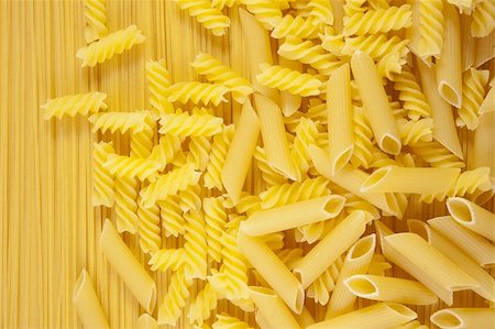 simsearch:400-04812854,k - Background of Macaroni on long spaghetti. Close up . Photographie de stock - Aubaine LD & Abonnement, Code: 400-04690410