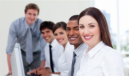 simsearch:400-04187328,k - Cheerful business team working at computers in a company Foto de stock - Royalty-Free Super Valor e Assinatura, Número: 400-04690606