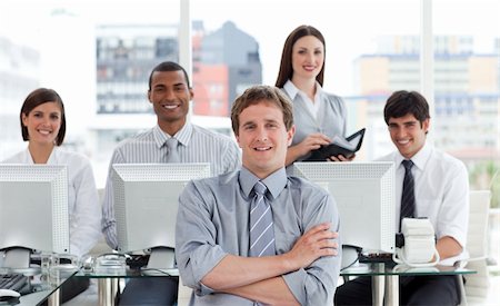simsearch:400-04187328,k - Portrait of a positive business team at work in the office Foto de stock - Royalty-Free Super Valor e Assinatura, Número: 400-04690614