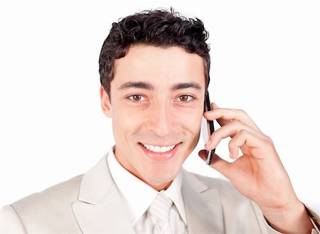 simsearch:400-07820348,k - Attractive ethnic businessman talking on phone against a white background Photographie de stock - Aubaine LD & Abonnement, Code: 400-04690861