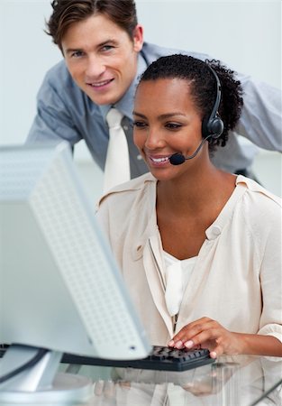 simsearch:400-04188205,k - Caucasian businessman helping his colleague at a computer Stock Photo - Budget Royalty-Free & Subscription, Code: 400-04690897