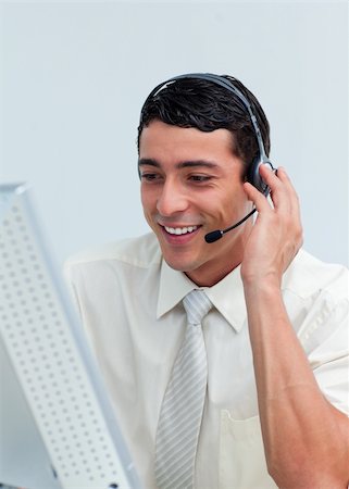 simsearch:400-04352175,k - Latin businessman talking on headset at work Stock Photo - Budget Royalty-Free & Subscription, Code: 400-04690904