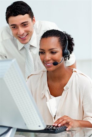 simsearch:400-04188205,k - Confident businessman helping his colleague at a computer Stock Photo - Budget Royalty-Free & Subscription, Code: 400-04690900