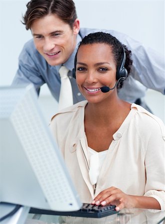 simsearch:400-04188205,k - Cheerful business partners working at a computer in the office Stock Photo - Budget Royalty-Free & Subscription, Code: 400-04690916