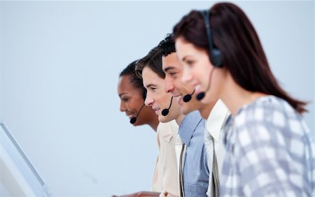 simsearch:400-04188205,k - Smiling customer service representatives working in a call center Stock Photo - Budget Royalty-Free & Subscription, Code: 400-04690910