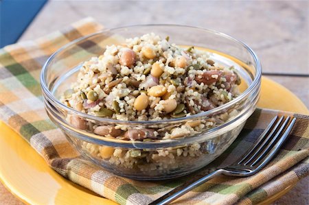 simsearch:400-04690974,k - A vegan favorite. Couscous salad made with sunflower seeds, and assorted beans such as farro, kidney beans. Topped with dressing made with olive oil, herbs and select spices. Foto de stock - Super Valor sin royalties y Suscripción, Código: 400-04690971