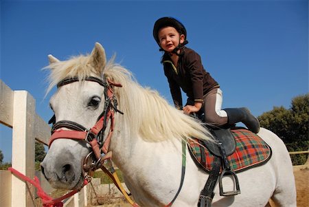 happy little girl and her friend white purebred shetland pony Foto de stock - Super Valor sin royalties y Suscripción, Código: 400-04691005