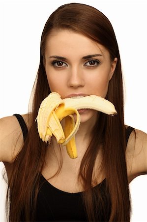 pretty women eating banana - girl holding a banana in his mouth Photographie de stock - Aubaine LD & Abonnement, Code: 400-04691013