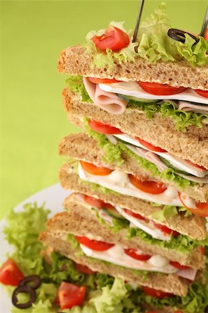 simsearch:400-04416282,k - Healthy sandwiches with ham, camembert, tomatoes, cucumber, lettuce and black olives Stock Photo - Budget Royalty-Free & Subscription, Code: 400-04691035