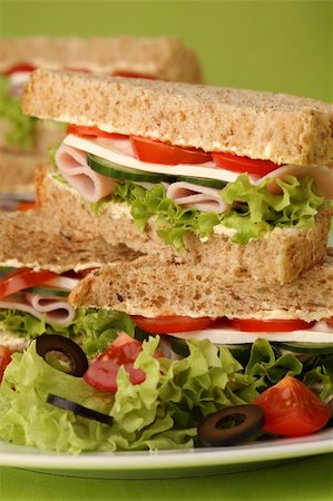 Healthy sandwiches with ham, camembert, tomatoes, cucumber, lettuce and black olives Stock Photo - Budget Royalty-Free & Subscription, Code: 400-04691030