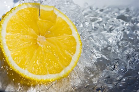 Fresh water drops on a lemon Stock Photo - Budget Royalty-Free & Subscription, Code: 400-04691138