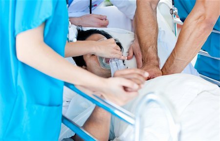 simsearch:400-04198266,k - Medical partners trying to reanimate a patient in the hospital Stockbilder - Microstock & Abonnement, Bildnummer: 400-04692277