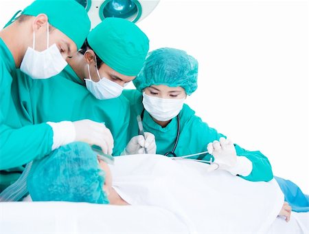 simsearch:400-04198266,k - Medicalteam making an operation using surgery equipment on a patient in the hospital Stockbilder - Microstock & Abonnement, Bildnummer: 400-04692286