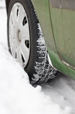 Car wheel is stuck in the snow Stock Photo - Budget Royalty-Free & Subscription, Code: 400-04692426