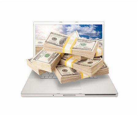 simsearch:400-04641104,k - Silver Computer Laptop Isolated on White with Stacks of Hundred Dollar Bills Extruding the Screen. Stockbilder - Microstock & Abonnement, Bildnummer: 400-04692825