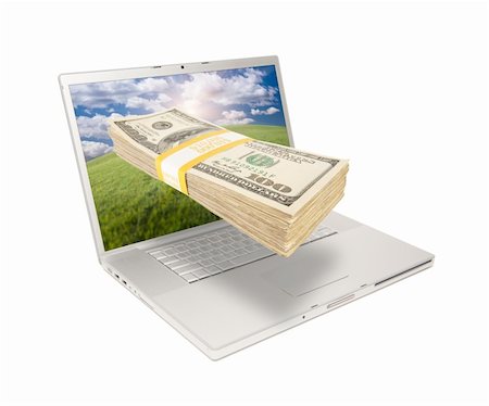 simsearch:400-04641104,k - Silver Computer Laptop Isolated on White with Stack of Hundred Dollar Bills Extruding the Screen. Stockbilder - Microstock & Abonnement, Bildnummer: 400-04692947