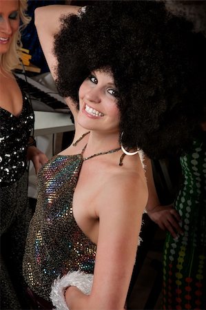 Pretty girl with afro wig at a 1970s Disco Music Party Stock Photo - Budget Royalty-Free & Subscription, Code: 400-04693004