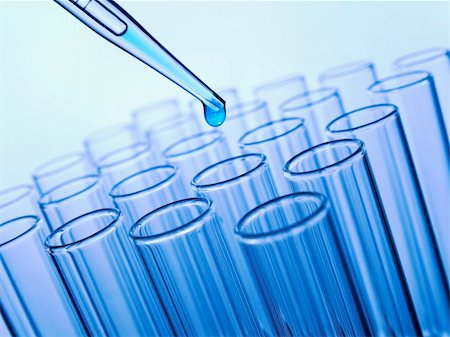 simsearch:400-07091851,k - Close up of a pipette dropping a blue sample into a test tube. Stock Photo - Budget Royalty-Free & Subscription, Code: 400-04693271