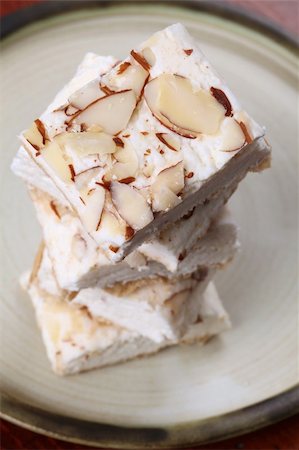 simsearch:400-04699511,k - A confectionary similar to the hard variety of the Spanish turron and Italian torrone produced in the Czech Republic. It is called "Turecky med" - literally "Turkish honey" and it is made from egg white, honey and various kinds of nuts. Stock Photo - Budget Royalty-Free & Subscription, Code: 400-04693359