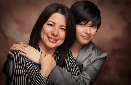 Attractive Multiethnic Mother and Daughter Studio Portrait on a Muslin Background. Stock Photo - Budget Royalty-Free & Subscription, Code: 400-04693599
