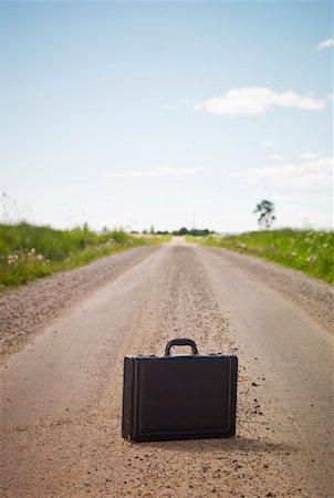 Lonley Briefcase on a Dirt Road Stock Photo - Budget Royalty-Free & Subscription, Code: 400-04693774