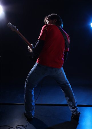 erdosain (artist) - Musician playing electric guitar on stage Foto de stock - Super Valor sin royalties y Suscripción, Código: 400-04693872