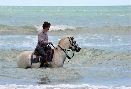 simsearch:400-04660370,k - riding man and his white horse in the sea Photographie de stock - Aubaine LD & Abonnement, Code: 400-04693916