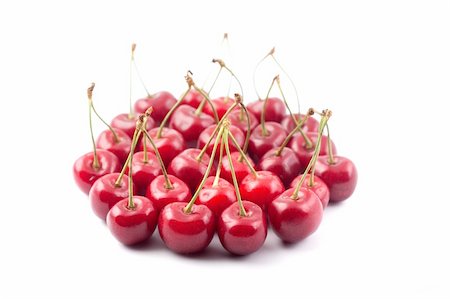 simsearch:400-08705784,k - Red cherries isolated on a white background Foto de stock - Royalty-Free Super Valor e Assinatura, Número: 400-04704384