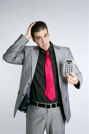 simsearch:400-05363701,k - Businessman formal suit bad number news reports calculator Stock Photo - Budget Royalty-Free & Subscription, Code: 400-04704760