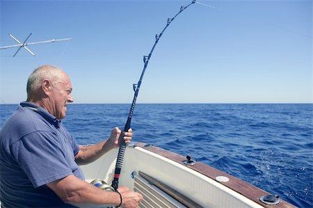 simsearch:400-05332014,k - Angler elderly big game sport fishing boat blue summer sea sky Stock Photo - Budget Royalty-Free & Subscription, Code: 400-04704791