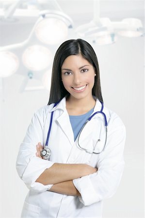 Beautiful brunette indian young happy doctor woman on surgery hospital Stock Photo - Budget Royalty-Free & Subscription, Code: 400-04704819