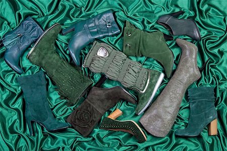 simsearch:400-05212510,k - Female shoes and boots placed on green satin. Studio shot Stock Photo - Budget Royalty-Free & Subscription, Code: 400-04705205