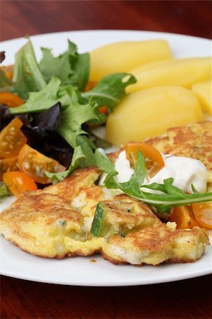 fried cherry tomatoes - Zucchini omelet with eggs and blue cheese. Shallow DOF Stock Photo - Budget Royalty-Free & Subscription, Code: 400-04705491