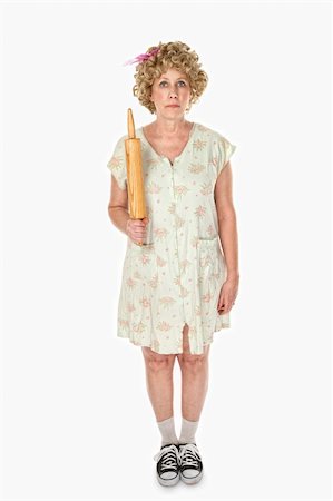 Unmoving housewife with rolling pin on white background Stock Photo - Budget Royalty-Free & Subscription, Code: 400-04705502