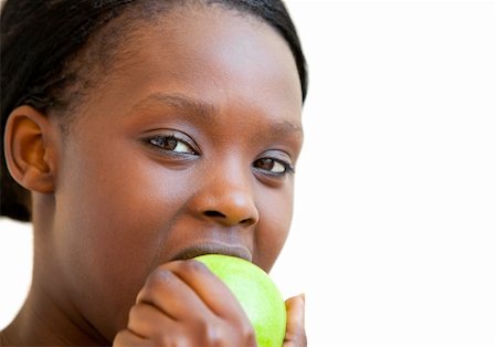 Sweet woman eating apple against white background Stock Photo - Budget Royalty-Free & Subscription, Code: 400-04705765