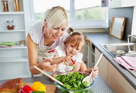simsearch:400-04206231,k - Attractive mother and child cooking in kitchen Stock Photo - Budget Royalty-Free & Subscription, Code: 400-04705815