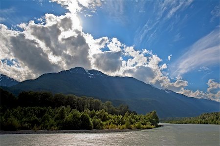 View of the Squamish River at Brackendale Eagles Provincial Park in British Columbia, Canada with sun flare behind dramatic clouds Stock Photo - Budget Royalty-Free & Subscription, Code: 400-04706353