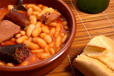 stew sausage - Fabada stew, regional Spanish cusine served in traditional clay casserole Stock Photo - Budget Royalty-Free & Subscription, Code: 400-04707627